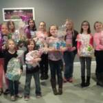 Girl Scout Troop #50214 and Troop #1433 with the Easter Baskets they made to sell. They donated all of the money to Sierra's
